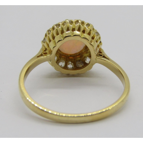 335 - Early 20th century 18ct cabochon opal and diamond cluster ring, the deep cabochon opal 3mm H x 6.5 d... 