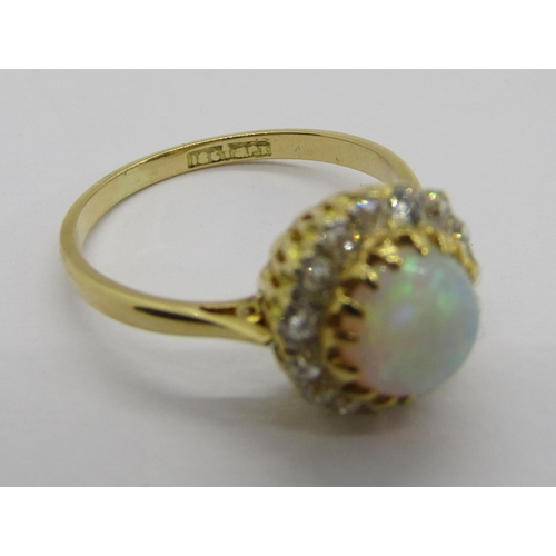 335 - Early 20th century 18ct cabochon opal and diamond cluster ring, the deep cabochon opal 3mm H x 6.5 d... 