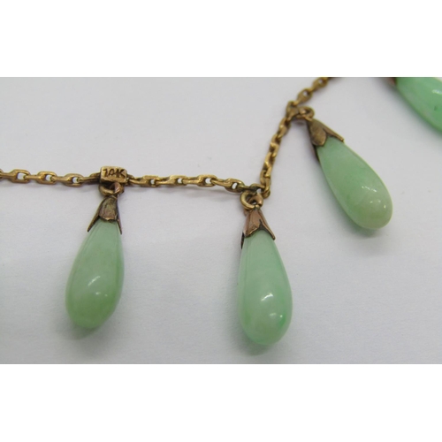 338 - Pair of early 20th century 14k jade drop earrings with screw fastenings, 5g, together with a similar... 