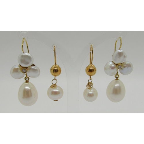 343 - Two pairs of yellow metal pearl drop earrings, to include a diamond set trefoil design pair, 11.3g t... 