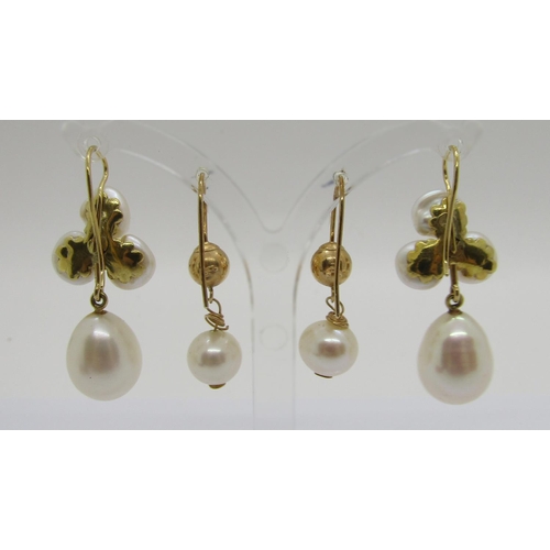 343 - Two pairs of yellow metal pearl drop earrings, to include a diamond set trefoil design pair, 11.3g t... 