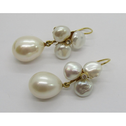 343 - Two pairs of yellow metal pearl drop earrings, to include a diamond set trefoil design pair, 11.3g t... 