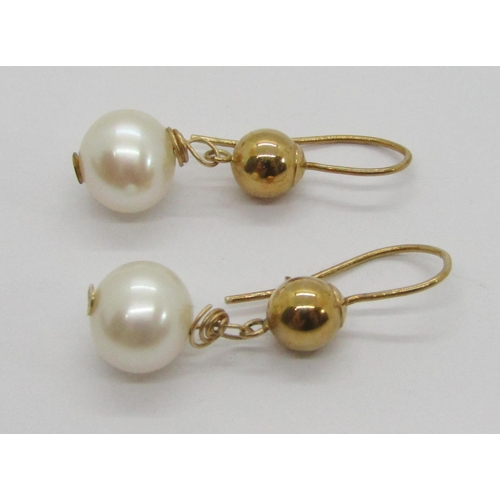 343 - Two pairs of yellow metal pearl drop earrings, to include a diamond set trefoil design pair, 11.3g t... 