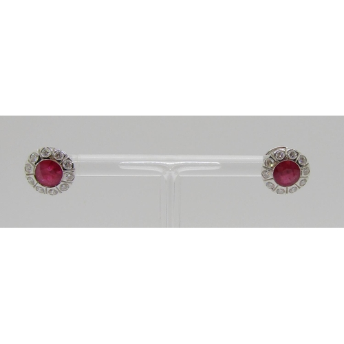 350 - Pair of 18ct white gold ruby and diamond cluster stud earrings, rubies 1ct each approx, 4.7g (one bu... 