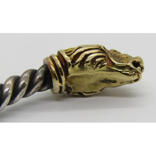 351 - Italian twisted white metal torque bangle with yellow metal lion head terminals, 24.6g