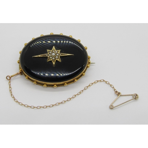 368 - Victorian yellow metal onyx mourning brooch with central star motif set with seed pearls and beaded ... 