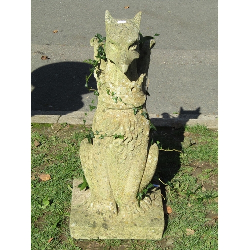 1019 - A weathered cast composition stone garden/pier ornament in the form of a seated dragon, 74 cm high