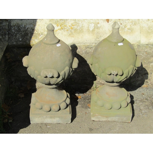 1022 - A pair of cast composition stone pier cap  finials in the form of pointed spheres with acanthus and ... 