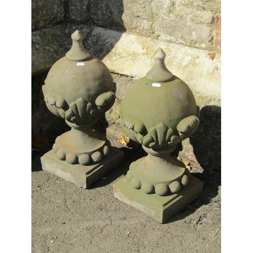 1022 - A pair of cast composition stone pier cap  finials in the form of pointed spheres with acanthus and ... 