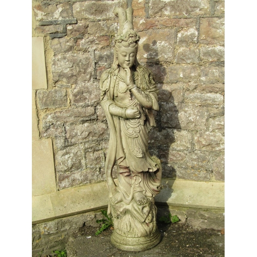 1028 - A weathered cast composition stone garden statue in the form of a standing oriental female in ceremo... 