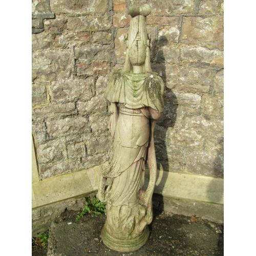 1028 - A weathered cast composition stone garden statue in the form of a standing oriental female in ceremo... 