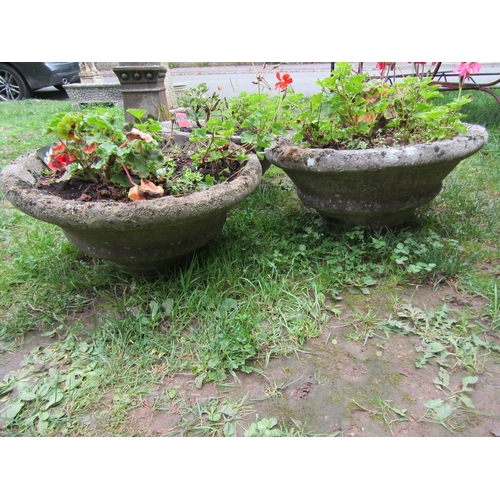 1037 - A pair of weathered cast composition stone squat conical shaped garden planters with ribbed detail, ... 