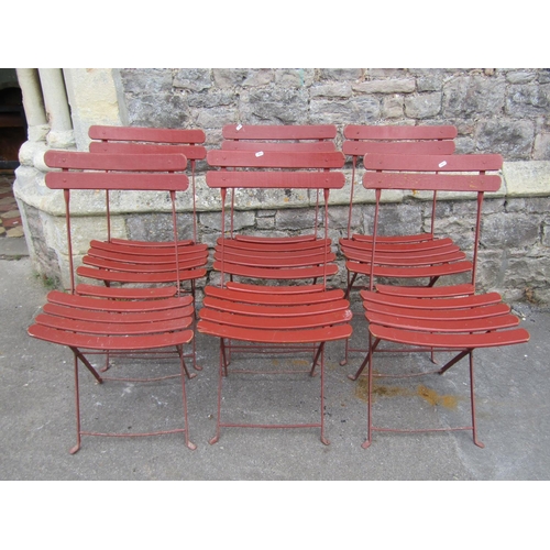 1041 - A set of six vintage folding garden chairs with painted slatted seats and iron frames