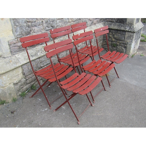 1041 - A set of six vintage folding garden chairs with painted slatted seats and iron frames