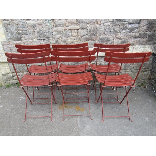 1041 - A set of six vintage folding garden chairs with painted slatted seats and iron frames