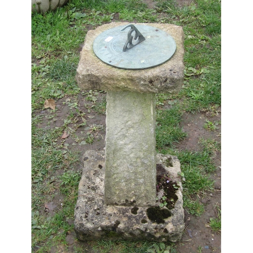 1046 - A weathered garden sun dial with pierced gnomon set and raised on a three sectional rough hewn base,... 