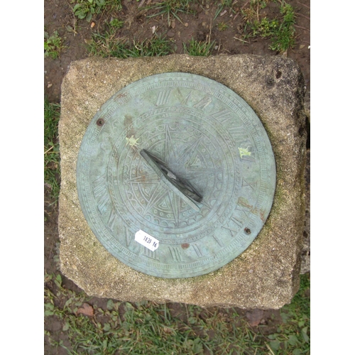 1046 - A weathered garden sun dial with pierced gnomon set and raised on a three sectional rough hewn base,... 