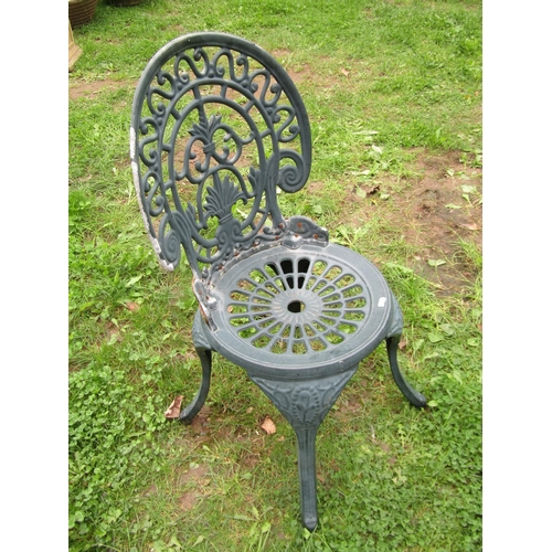 1048 - A weathered  green painted cast alloy garden terrace table of circular form with decorative pierced ... 