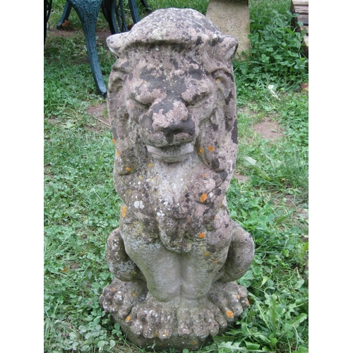 1052 - A pair of weathered cast composition stone ornament in the form of recumbent lions 36 cm high x 70 c... 