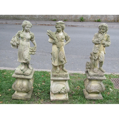 1054 - Three weathered cast composition stone garden ornaments representing three of the four seasons raise... 