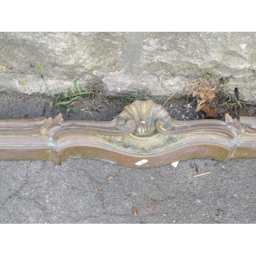 1096 - A 19th century Rococo fire curb/fender 127 cm together with a copper and brass jug with loop handle ... 