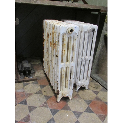 1099 - A pair of reclaimed cast iron floorstanding radiators, 62 cm high x 55 cm long x 14 cm (for recommis... 