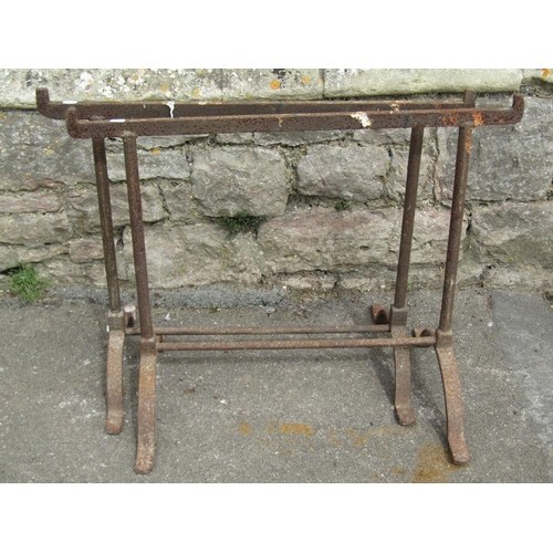 1100 - A pair of old  wrought iron trestles with swept supports, 64 cm (full height) x 78 cm (full width)