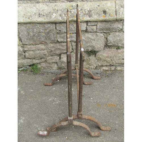 1100 - A pair of old  wrought iron trestles with swept supports, 64 cm (full height) x 78 cm (full width)