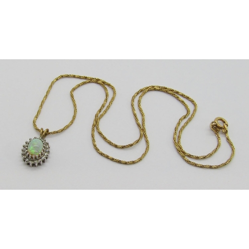 388 - 9ct oval opal and diamond cluster pendant, hung from an associated 9ct rope twist chain necklace, ch... 