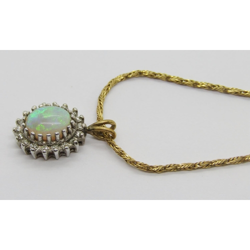 388 - 9ct oval opal and diamond cluster pendant, hung from an associated 9ct rope twist chain necklace, ch... 