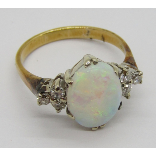 396 - Early to mid-20th century 18ct opal and diamond ring, the claw set oval opal flanked by a pair of di... 