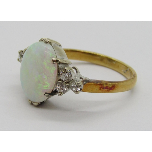 396 - Early to mid-20th century 18ct opal and diamond ring, the claw set oval opal flanked by a pair of di... 