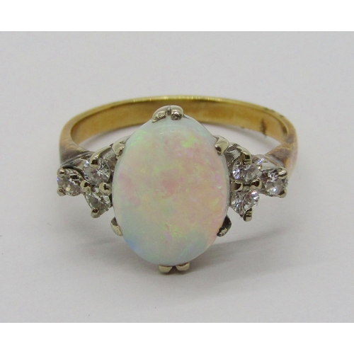 396 - Early to mid-20th century 18ct opal and diamond ring, the claw set oval opal flanked by a pair of di... 