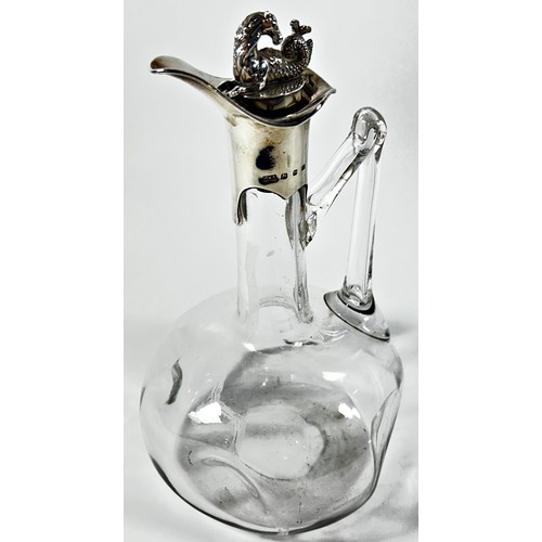 273 - A late Victorian dimpled glass decanter with a silver hippocampus cork stopper spout and collar, Bir... 