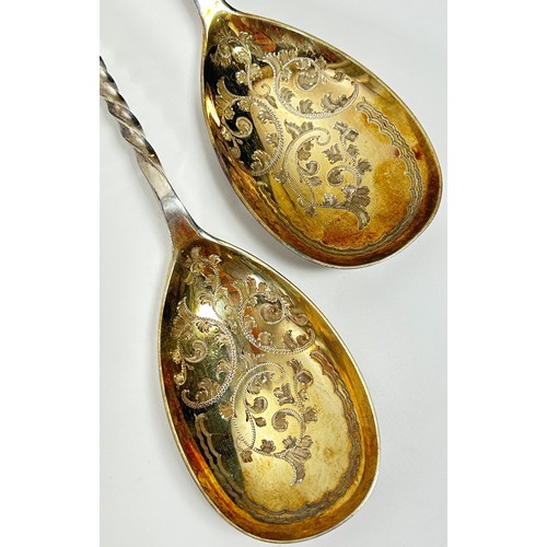 240 - A pair of cased heavily engraved serving spoons, Sheffield 1903, maker Atkin Brothers, 21 cm long, 4... 