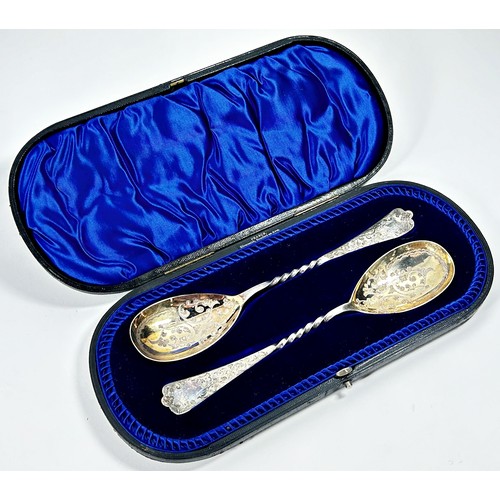 240 - A pair of cased heavily engraved serving spoons, Sheffield 1903, maker Atkin Brothers, 21 cm long, 4... 