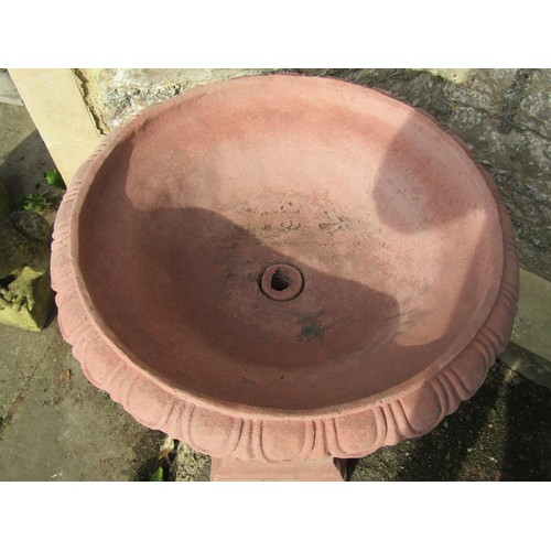 1024 - A pair of cast composition stone garden urns with faux terracotta finish, the squat circular lobed b... 