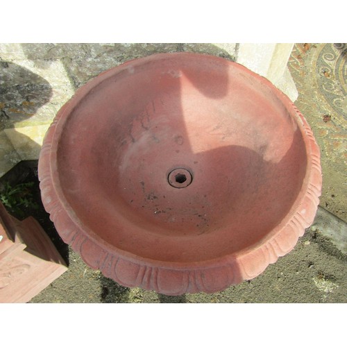 1024 - A pair of cast composition stone garden urns with faux terracotta finish, the squat circular lobed b... 