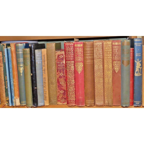 822 - A small mixed library of literature and reference including works by Lamb, H G Wells, Ruskin, Defoe,... 