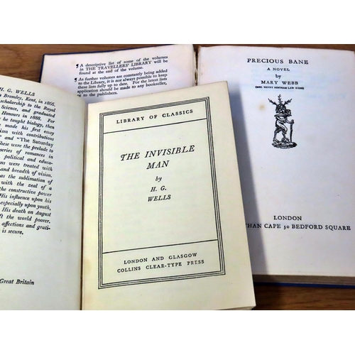 822 - A small mixed library of literature and reference including works by Lamb, H G Wells, Ruskin, Defoe,... 