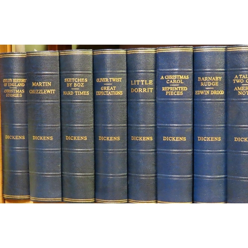 824 - Fifteen blue bound volumes of Charles Dickens and twelve brown bound volumes of classic literature, ... 