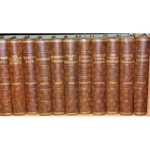 824 - Fifteen blue bound volumes of Charles Dickens and twelve brown bound volumes of classic literature, ... 