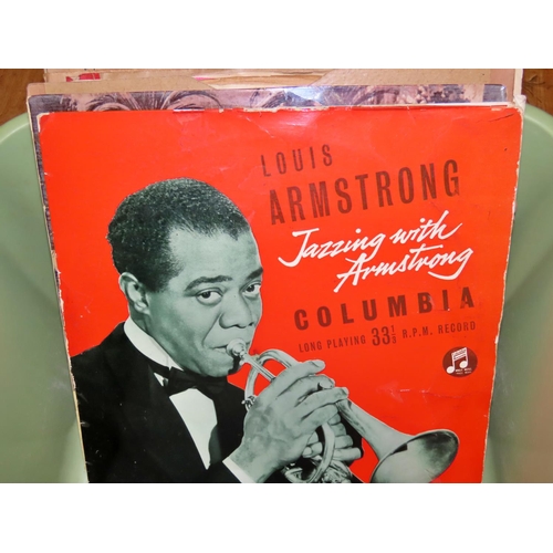 866 - A small collection of 33 and a third records to include early recordings by Louis Armstrong, Nina Si... 