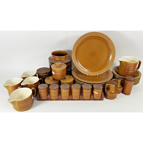 144 - A large collection of Hornsea saffron tableware, comprising graduating plates, bowls, tureens, jugs,... 