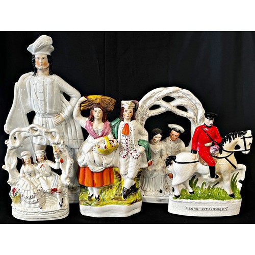 143 - A large collection of mixed ceramics to include Staffordshire figures, two couples in arbours, glass... 