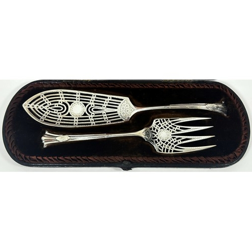 247 - A cased pair of Mappin & Webb fish servers, Sheffield 1894, both with intricate engraving and open w... 