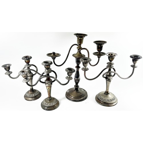 203 - A quantity of silver plated tableware including toast racks, candelabra, tureens, loose bone handled... 