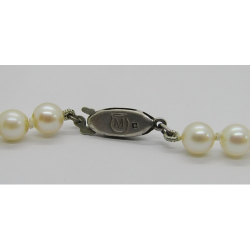 416 - Mikimoto pearl necklace with silver clasp, retailed by Lane Crawford, Hong Kong, sixty-six pearls pl... 