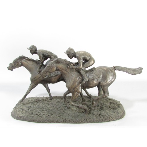 612 - “ Still in the race” a group of three bronze resin race horse and jockey studies, 21cm high approxim... 