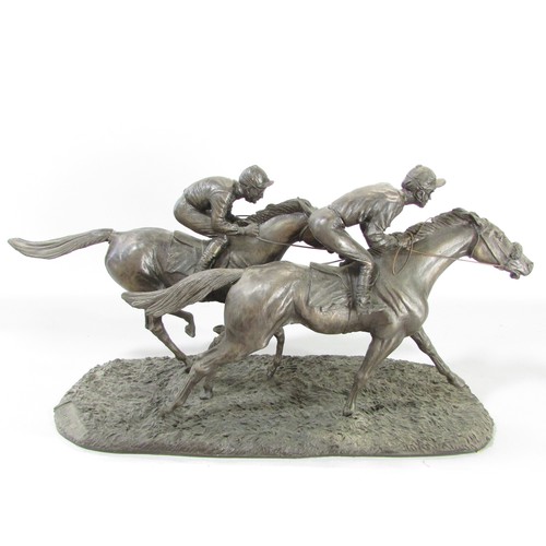 612 - “ Still in the race” a group of three bronze resin race horse and jockey studies, 21cm high approxim... 